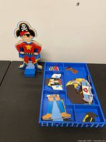 Full set with dressed figure and tray of clothing pieces