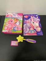 Lot overview showing Busy Book, coloring book, magic wand and Princess card