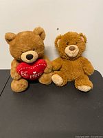 Both teddy bears front view on table