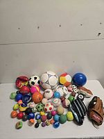 Group shot of entire lot showing gloves and mixed balls