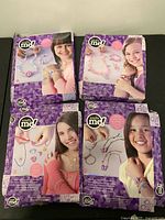 All four Totally Me! jewelry craft kits front view