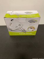 Front of boxed Traditions by Proctor Silex 5-speed hand mixer