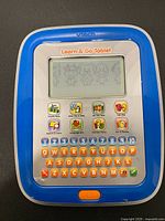 Front view of VTech Learn & Go Tablet showing screen, keyboard and icons
