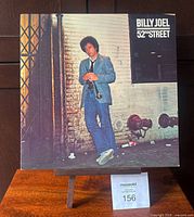 Front cover of Billy Joel 52nd Street LP on stand