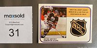 Front of 1981-82 O-Pee-Chee Wayne Gretzky Assist Leader card #383 next to lot number card