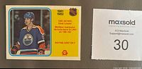 Front of Wayne Gretzky O-Pee-Chee card showing Edmonton Oilers image and goal leader banner