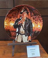 Front view of Indiana Jones collector plate on stand