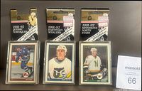Front view of three sealed 1991-92 O-Pee-Chee hockey team sets for Nordiques, Whalers, North Stars