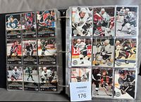 Open binder showing multiple nine-pocket pages filled with 1991-92 Pro Set Platinum hockey cards