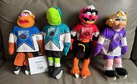 Front view of all four NHL Muppets plush dolls standing