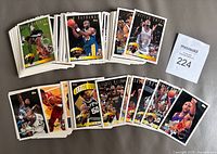 Stacks of 1995-96 Topps basketball cards displayed, lot ticket visible