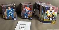 Stacks of hockey trading cards arranged in three groups