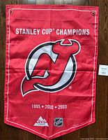 Front side of banner in English with team logo, years, Coors Light and NHL logos