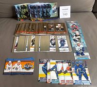 Grouped stacks of the six insert types laid out on sofa, showing quantity and card fronts