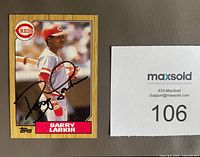 Front of Barry Larkin 1987 Topps card with autograph