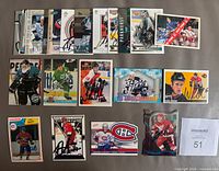 All 25 autographed hockey cards laid out front side up