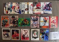 All 25 signed hockey cards laid out