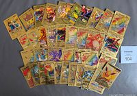 All 37 gold foil Pokémon fan art cards spread out