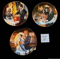 Front view of all three plates showing artwork