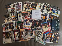 Overhead view of entire lot of Mario Lemieux cards spread out