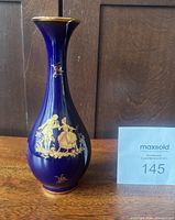 Full view of vase showing cobalt glaze, gold decoration and overall form