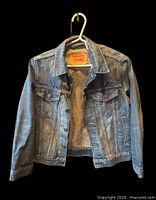 Front view open showing chest pockets, buttons, label