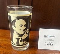 Side A of glass showing portrait of Pierre Elliott Trudeau eating ice cream