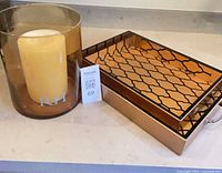 Amber glass hurricane with candle and large tray