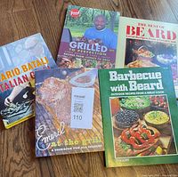 All five cookbooks laid out, covers visible