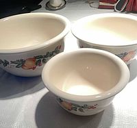 Full view of three nested bowls showing size differences and exterior pattern