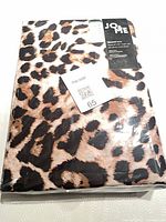 Front of sealed packaging showing leopard print fabric and Jo & Me branding