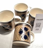 Four Mikasa mugs angled to show pattern and interiors