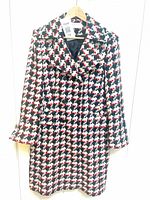 Full view of the Precis Petite check coat on hanger