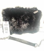 Front view of black rabbit fur RUDSAK crossbody bag with chain strap and lot tag visible