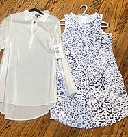 Both cover-ups on hangers, full front view