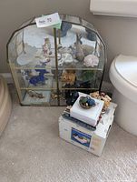 Cabinet with figurines and memo holder box