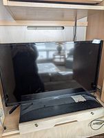 Front view of Samsung 32-inch TV on stand