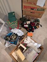 Overall lot showing wreath, plush figures, boxes and bags of ornaments