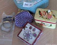 Group shot showing jewelry box, watches, coin purse, jewelry set, brooches and tin