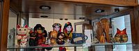 Shelf view of entire assortment of Asian decorative items