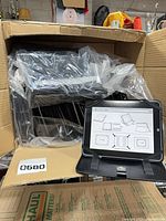 Open case displayed on front of the lot with boxed cases behind