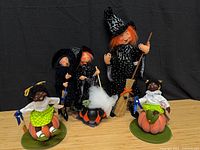 Group shot of all five Annalee dolls: two Patsy pumpkin figures and three witches