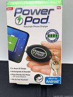 Front of Power Pod retail box showing device and features