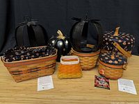 Group shot of all baskets, metal holders and ceramic pumpkin