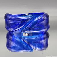Front view of cobalt blue translucent lucite hinged cuff bracelet