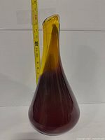 Full view of vase with tape measure showing 15 in height