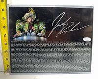 Front view of signed photo in sleeve with autograph and JSA sticker