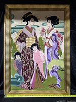 Full view of framed needlepoint artwork