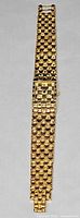 Full view of Longines goldtone basket weave watch