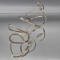 Full view of coiled snake cuff bracelet